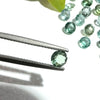 This parcel of 21 round cuts of natural unheated tourmaline ranges from light green to pale teal blue to mid green blue.&nbsp;