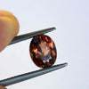 warm but dark toned natural zircon with a hint of peach undertone
