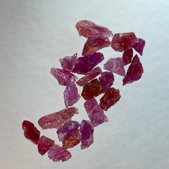 These parcels of ruby are totally natural and unheated. The pieces show a variety of tones of red purplish red and reddish pink colour, they are also quite flat allowing more light to pass through for better colour and making them face up larger than their weight would assume. Material is from Mozambique.