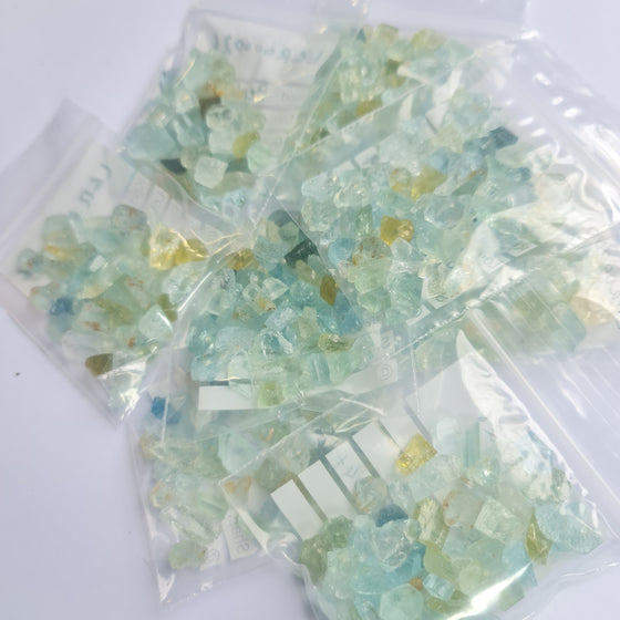 These parcels are a mix of natural, unheated aquamarine, helidor, green beryl and goshenite from Nigeria. This material has moderate inclusions, but is very gemmy material and a great choice for anyone looking to get into gem cutting!