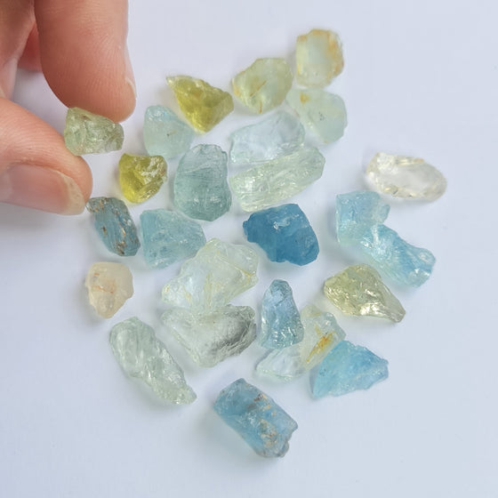 These parcels are a mix of natural, unheated aquamarine, helidor, green beryl and goshenite from Nigeria. This material has moderate inclusions, but is very gemmy material and a great choice for anyone looking to get into gem cutting!