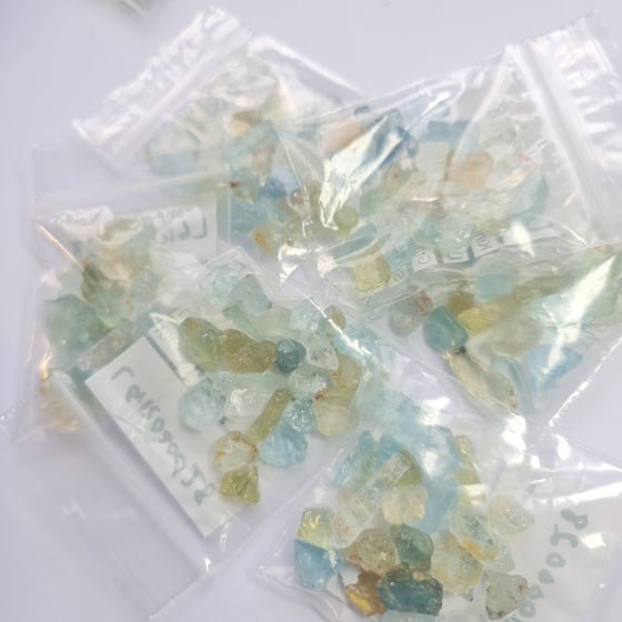 These parcels are a mix of natural, unheated aquamarine, helidor, green beryl and goshenite from Nigeria. This material has moderate inclusions, but is very gemmy material and a great choice for anyone looking to get into gem cutting!