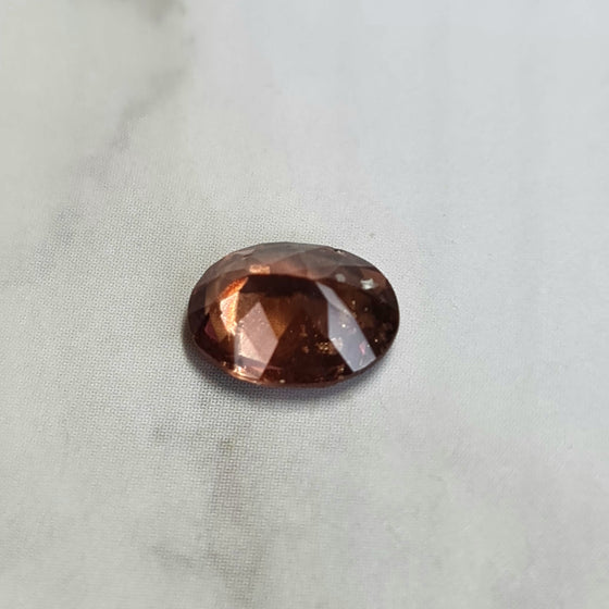 1.19ct Orange Brown Unheated Oval Cut Sapphire