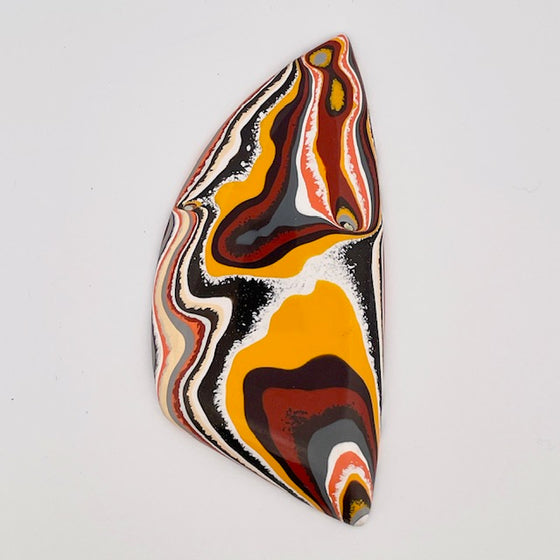 This great piece of original fordite was salvaged from former Ford factory in Detroit. The piece is in fantastic 70's colours, great for funky jewellery.