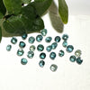 This parcel of 27 round cuts of natural unheated tourmaline ranges from light green to pale teal blue.&nbsp; They are all eye clean. The depth varies.
