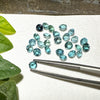 This parcel of 27 round cuts of natural unheated tourmaline ranges from light green to pale teal blue.&nbsp; They are all eye clean. The depth varies.