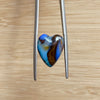 8.75ct Heart Shape Boulder Opal, this heart has swirling patterns of dark blue, light blue gold and brown, the colour is also on the sides making it a perfect pendant piece.