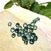 This parcel of 27 round cuts of natural unheated tourmaline ranges from light green to pale teal blue.&nbsp; They are all eye clean. The depth varies.