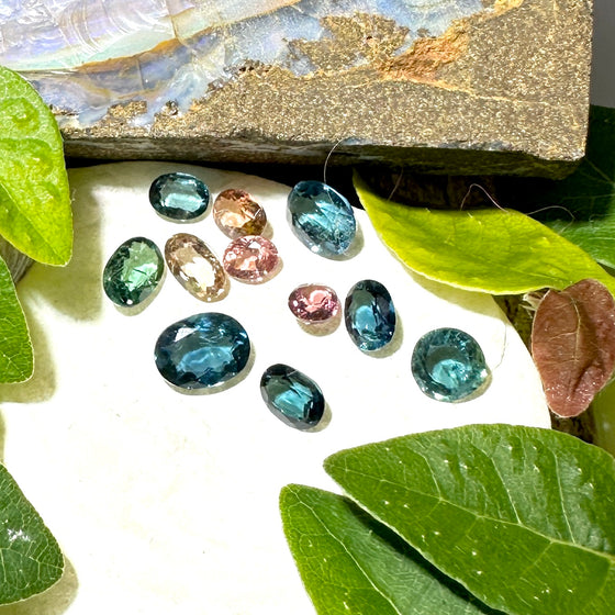 This parcel of 11 mixed cuts of natural unheated tourmaline ranges from light green to&nbsp; teal blue and peach pink They are all eye clean. The depth varies.