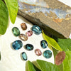 This parcel of 11 mixed cuts of natural unheated tourmaline ranges from light green to&nbsp; teal blue and peach pink They are all eye clean. The depth varies.