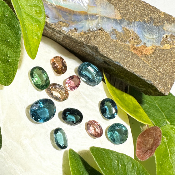 This parcel of 11 mixed cuts of natural unheated tourmaline ranges from light green to&nbsp; teal blue and peach pink They are all eye clean. The depth varies.