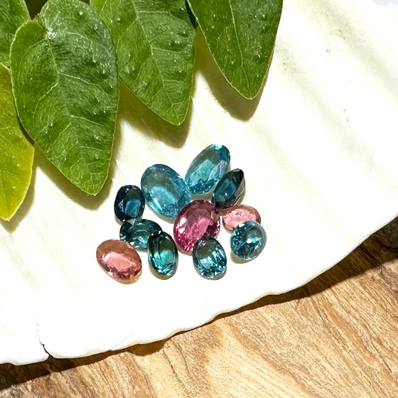 This parcel of 11 mixed cuts of natural unheated tourmaline in teal blue and pink. They are all eye clean. The depth varies.