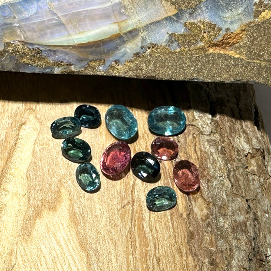 This parcel of 11 mixed cuts of natural unheated tourmaline in teal blue and pink. They are all eye clean. The depth varies.