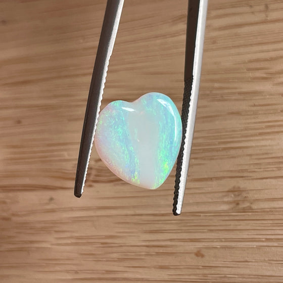 3.10ct Heart Shape Crystal Opal8.40ct Freeform Boulder Opal. A very pretty well shaped heart with a streak of pink running through the centre and apple green on the sides. 