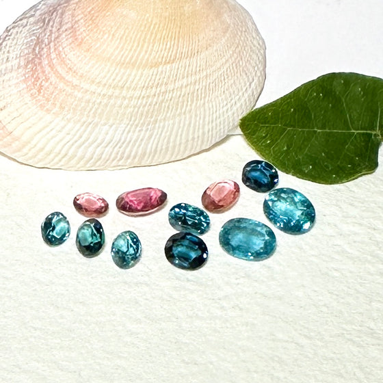 This parcel of 11 mixed cuts of natural unheated tourmaline in teal blue and pink. They are all eye clean. The depth varies.