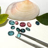 This parcel of 11 mixed cuts of natural unheated tourmaline in teal blue and pink. They are all eye clean. The depth varies.
