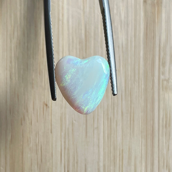 4.35ct Heart Shape Crystal Opal, this piece shows green, pink and gold running diagonally across the heart. A really stunning stone.