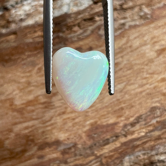 4.35ct Heart Shape Crystal Opal, this piece shows green, pink and gold running diagonally across the heart. A really stunning stone.