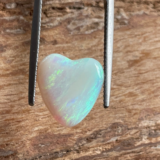 4.35ct Heart Shape Crystal Opal, this piece shows green, pink and gold running diagonally across the heart. A really stunning stone.