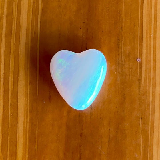 4.35ct Heart Shape Crystal Opal, this piece shows green, pink and gold running diagonally across the heart. A really stunning stone.