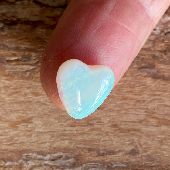 4.35ct Heart Shape Crystal Opal, this piece shows green, pink and gold running diagonally across the heart. A really stunning stone.
