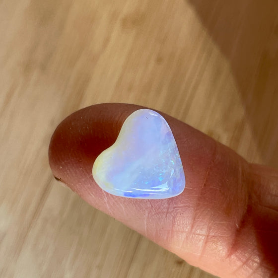 3.40ct Heart Shape Crystal Opal. This small heart has an overall clear golden blue colour, very soft and pretty.