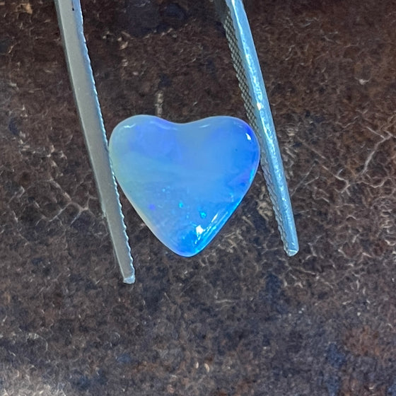 3.40ct Heart Shape Crystal Opal. This small heart has an overall clear golden blue colour, very soft and pretty.