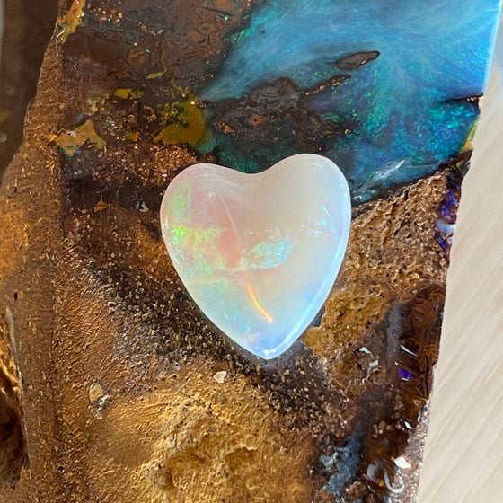 3ct Heart Shape Crystal Opal, this heart shaped opal has a great flash of bright green on one side, with more green and purple sparkle through it.