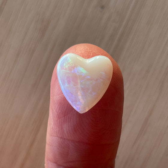 3ct Heart Shape Crystal Opal, this heart shaped opal has a great flash of bright green on one side, with more green and purple sparkle through it.