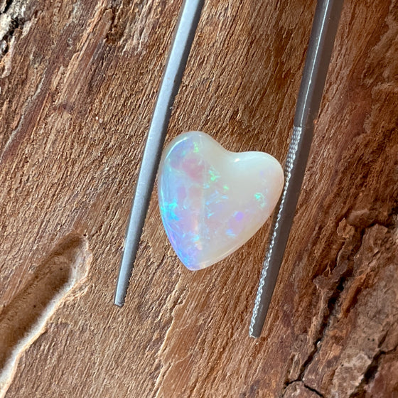 3ct Heart Shape Crystal Opal, this heart shaped opal has a great flash of bright green on one side, with more green and purple sparkle through it.