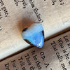 5ct Heart Shape Boulder Opal, this tiny heart is clear misty blue across the top with a slightly darker blue at the base. The cutter has used the patterns in the opal to enhance the piece.