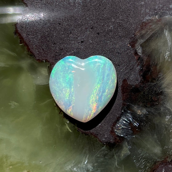 3.10ct Heart Shape Crystal Opal8.40ct Freeform Boulder Opal. A very pretty well shaped heart with a streak of pink running through the centre and apple green on the sides. 
