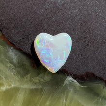  3ct Heart Shape Crystal Opal, this heart shaped opal has a great flash of bright green on one side, with more green and purple sparkle through it.