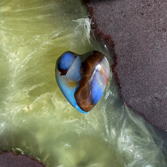 8.75ct Heart Shape Boulder Opal, this heart has swirling patterns of dark blue, light blue gold and brown, the colour is also on the sides making it a perfect pendant piece.