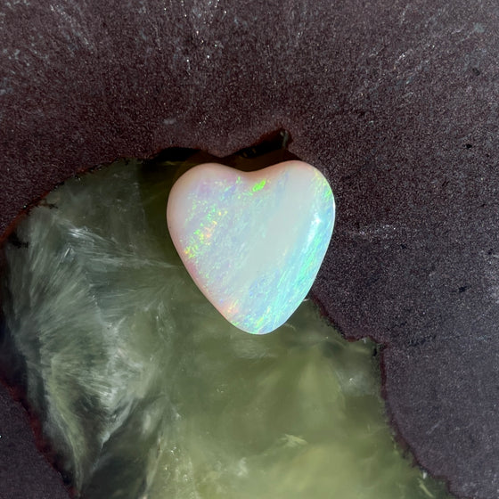 4.35ct Heart Shape Crystal Opal, this piece shows green, pink and gold running diagonally across the heart. A really stunning stone.