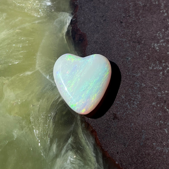 4.35ct Heart Shape Crystal Opal, this piece shows green, pink and gold running diagonally across the heart. A really stunning stone.
