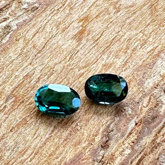 This parcel of 2 oval cut natural unheated tourmaline are a rich dark teal blue.  They are eye clean. The stones are very slightly different in colour and shape. Responsibly sourced.