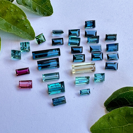 This parcel of 29 pieces of natural unheated tourmaline ranges from green to darker teal to lighter blue/teal, also pink and champagne. They are all eye clean and assorted similar size and shape, not all exactly alike.