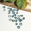 This parcel of 27 round cuts of natural unheated tourmaline ranges from light green to pale teal blue.&nbsp; They are all eye clean. The depth varies.