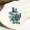 This parcel of 27 round cuts of natural unheated tourmaline ranges from light green to pale teal blue.&nbsp; They are all eye clean. The depth varies.