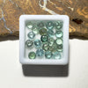 This parcel of 21 round cuts of natural unheated tourmaline ranges from light green to pale teal blue to mid green blue.&nbsp;
