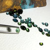 This parcel of 30 pieces of natural unheated tourmaline ranges from light teal blue to mid green to dark teal. They are all eye clean and assorted size cabochon cut.