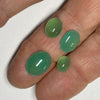 These natural chrysoprase cabochons were mined in Queensland Australia. The larger pieces are a beautiful and consistent mid luminous blue green, the two smaller have a more apple green shade. 
