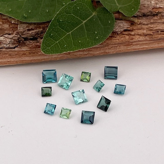 This parcel of 12 tiny natural unheated tourmaline are mostly pale green and blue. They are all eye clean and are assorted sizes between 2-3mm
