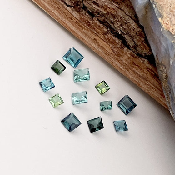 This parcel of 12 tiny natural unheated tourmaline are mostly pale green and blue. They are all eye clean and are assorted sizes between 2-3mm