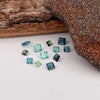 This parcel of 12 tiny natural unheated tourmaline are mostly pale green and blue. They are all eye clean and are assorted sizes between 2-3mm