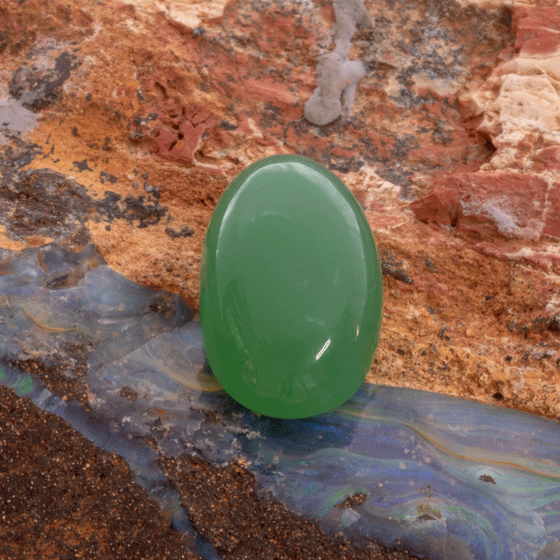Lovely luminescent green chrysoprase oval cabochon cut loose gemstone