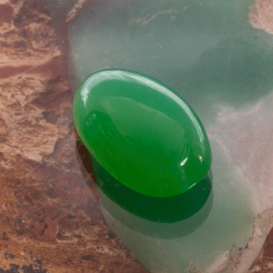 Lovely luminescent green chrysoprase oval cabochon cut loose gemstone