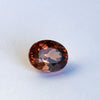 warm but dark toned natural zircon with a hint of peach undertone