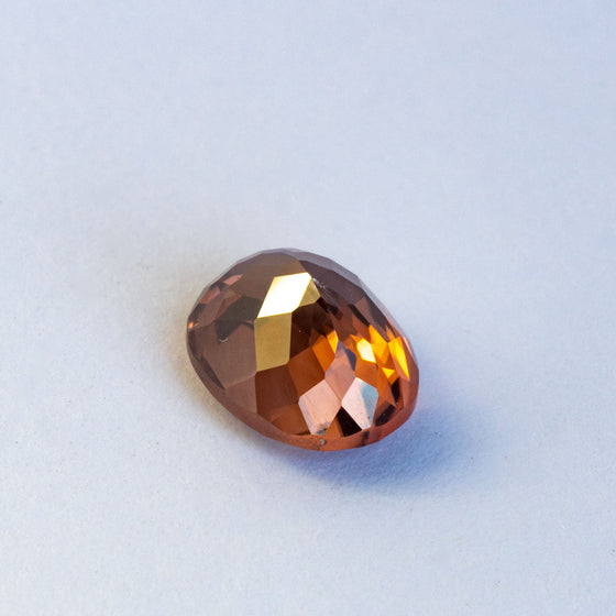 warm but dark toned natural zircon with a hint of peach undertone